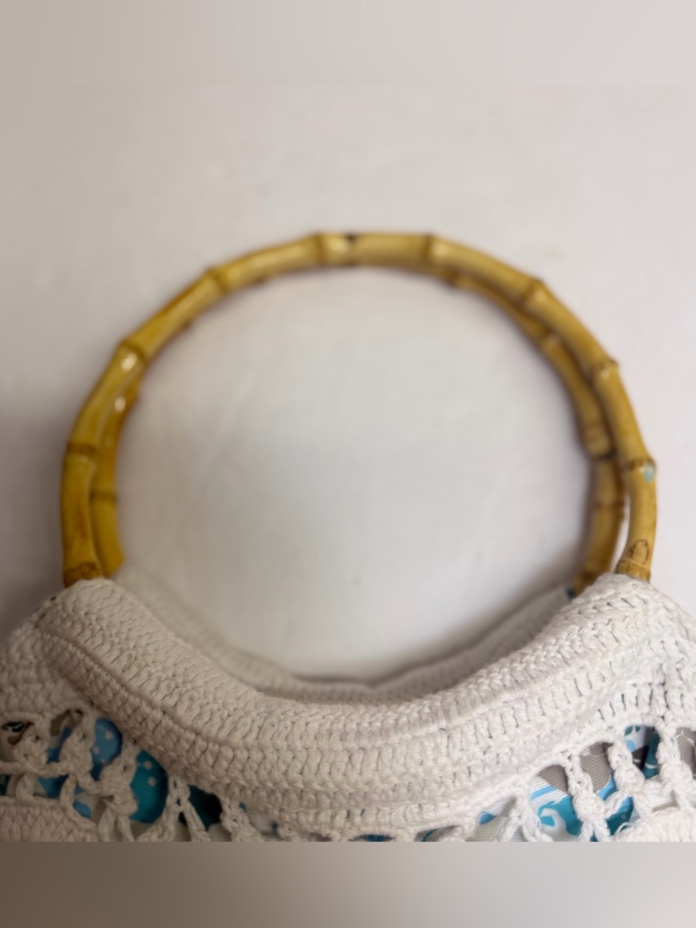 Lilu White Crochet Purse with teal and‎ gray floral underlay Bamboo Handles. - Picture 3 of 10